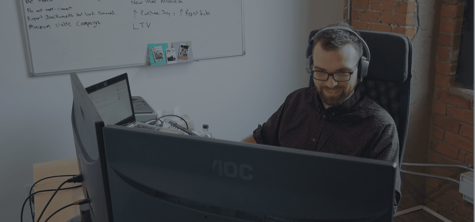 Director of paid media behind computer