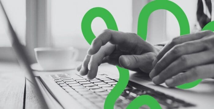 Someone typing on a computer